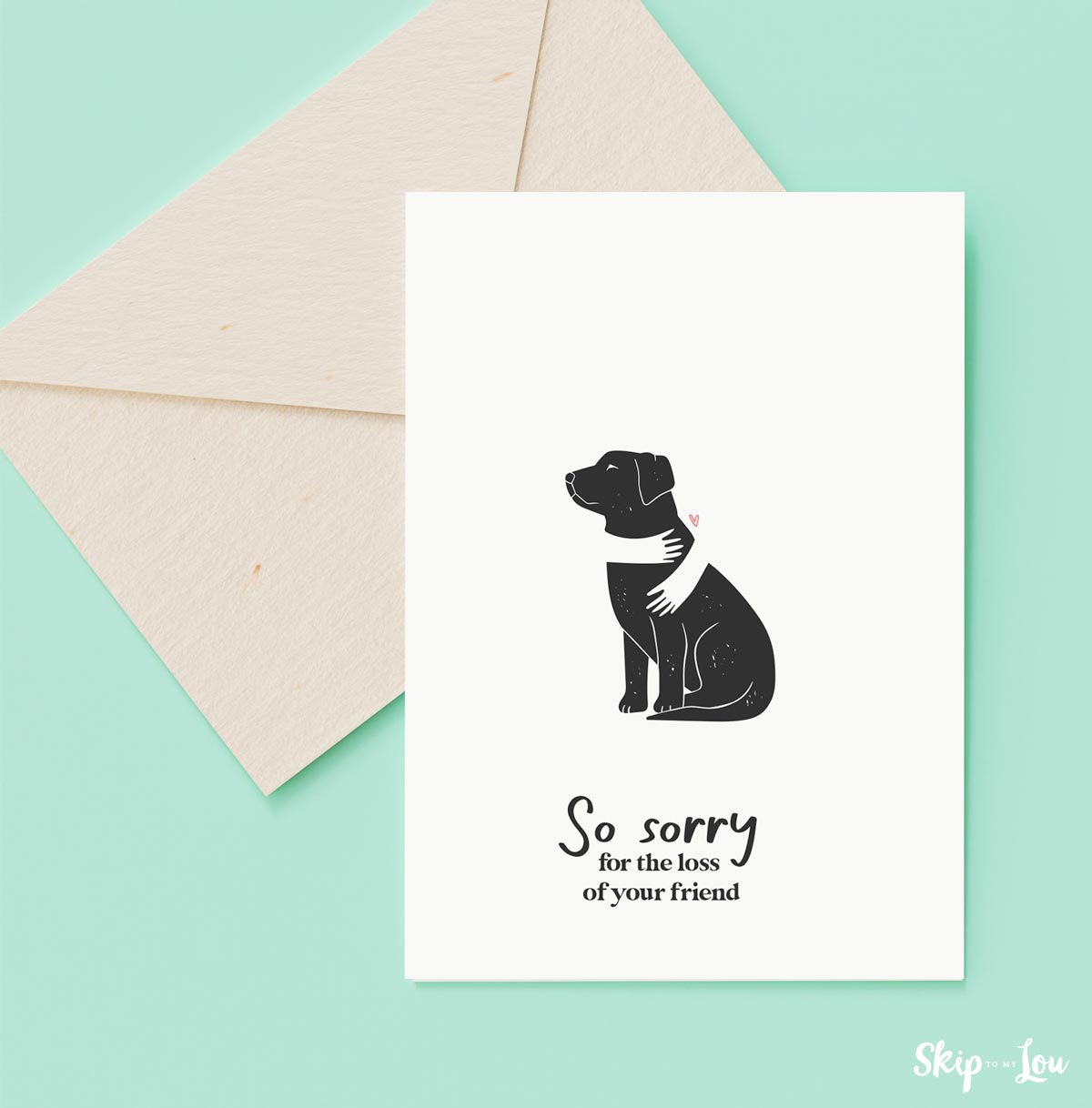 Image shows a pet sympathy card for dogs that says So sorry for the loss of your friend, in front of an envelope.