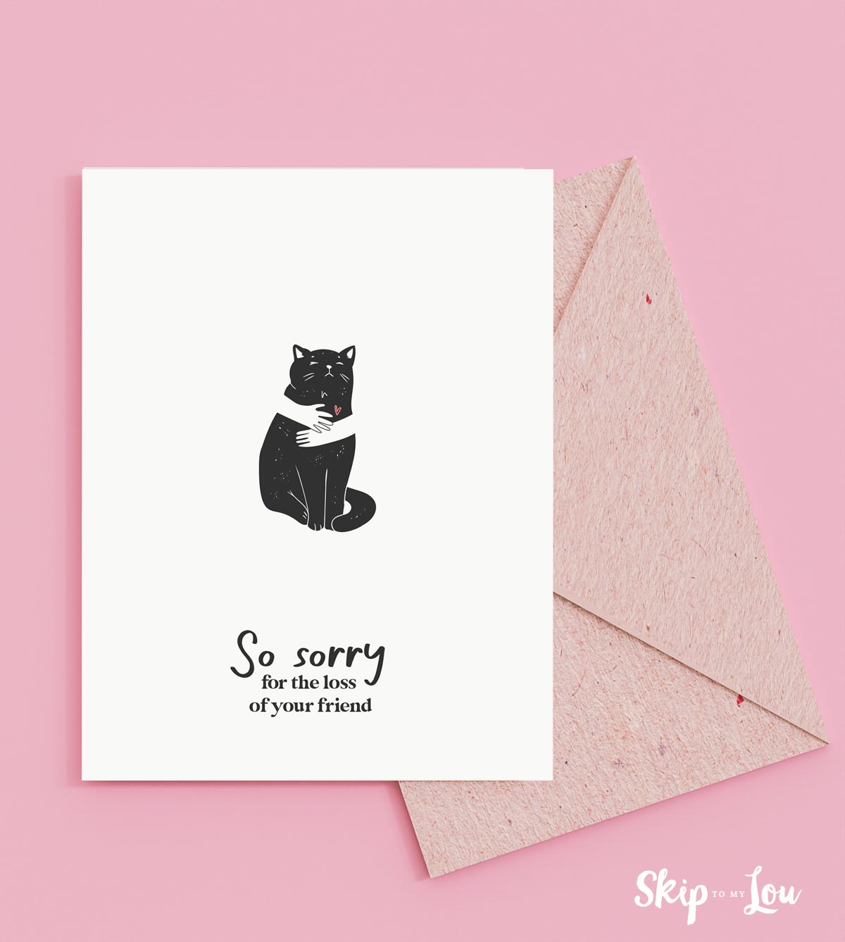 Image shows a pet sympathy card for cats that says So sorry for the loss of your friend, in front of a pink envelope.