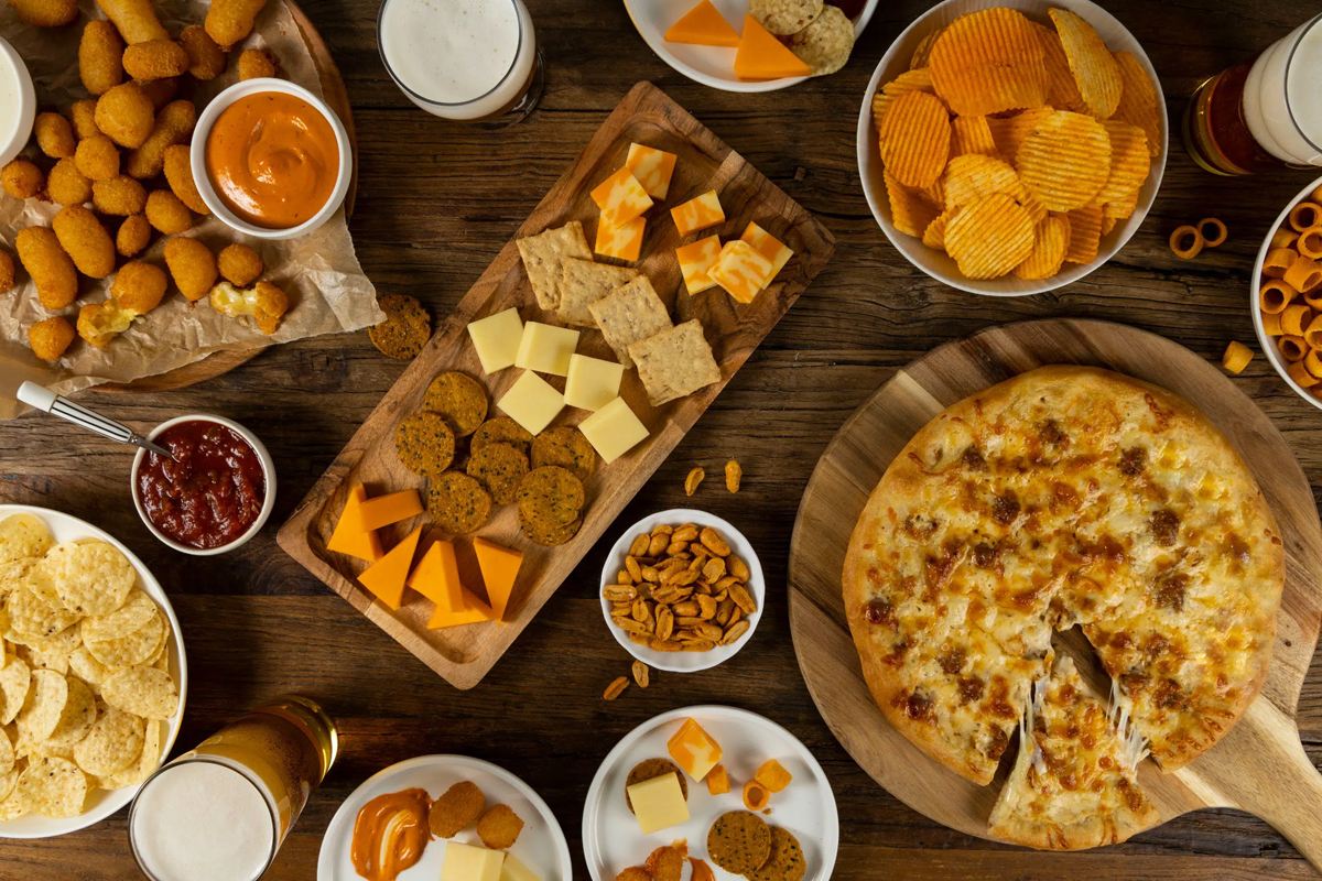 Paradise Foods charcuterie board showcases crackers, cheese, chips and dip.