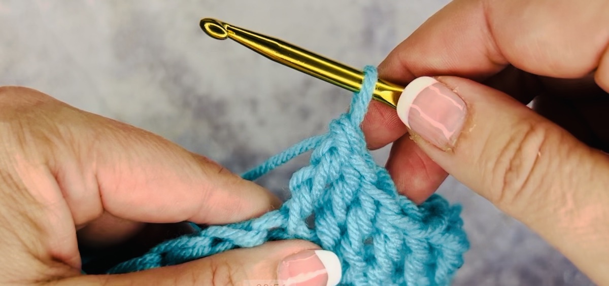 Treble crochet - last step in blue yarn