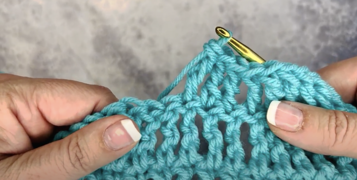 Step 1 to make a treble crochet. Start with a foundation chain and create as many rows as needed.