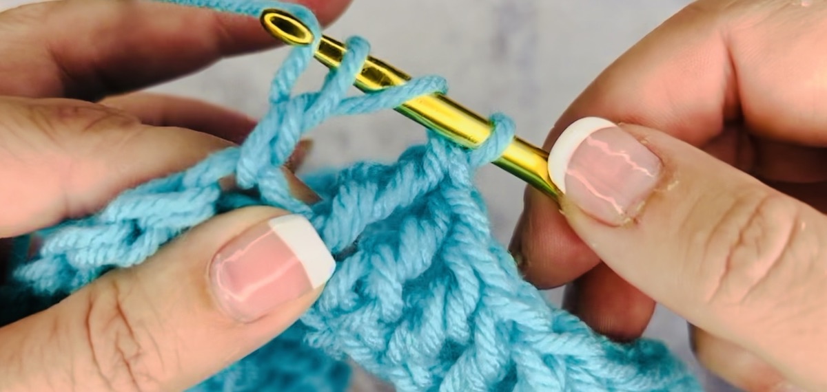 Step 5 to do a treble crochet: Yarn over again and pull through the next two loops on your hook. 