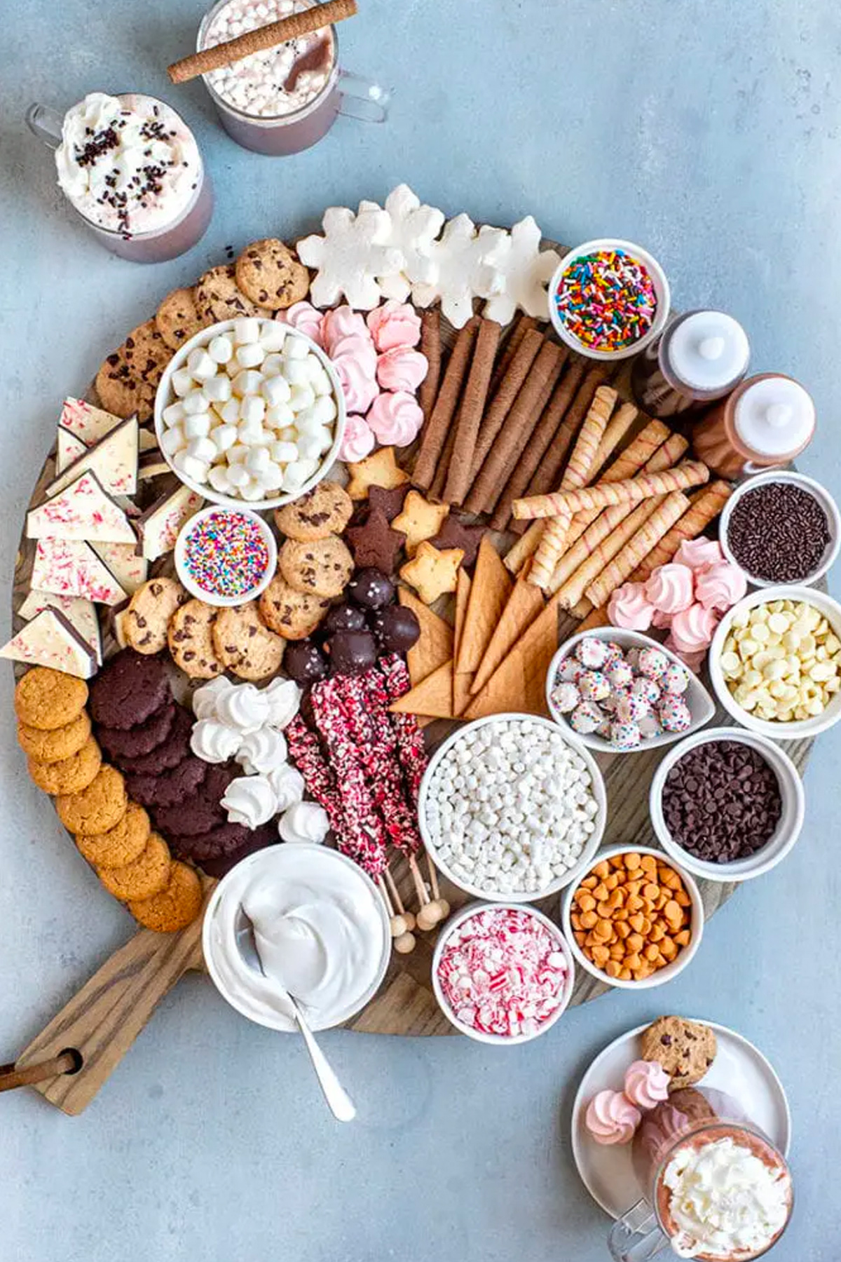 Marshmallows, cookies, chocolate, and sprinkles are included on Ain't Too Proud to Meg's Hot Chocolate Bar board.