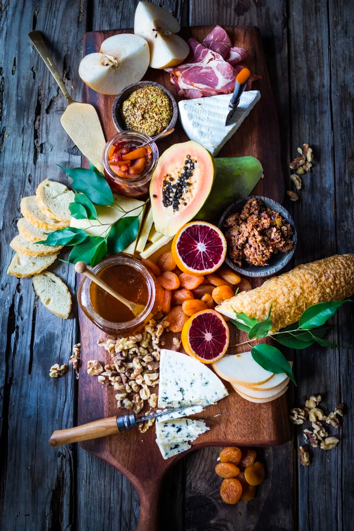 Cheese, meats, nuts, and seasonal fruit complete Feasting at Home's winter grazing board.
