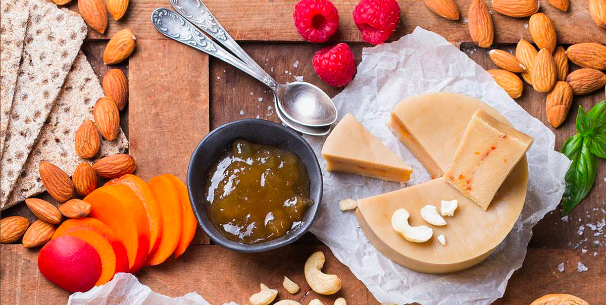 Cheese, nuts, meat, and fruit fill Meal Gardens vegan winter charcuterie board.