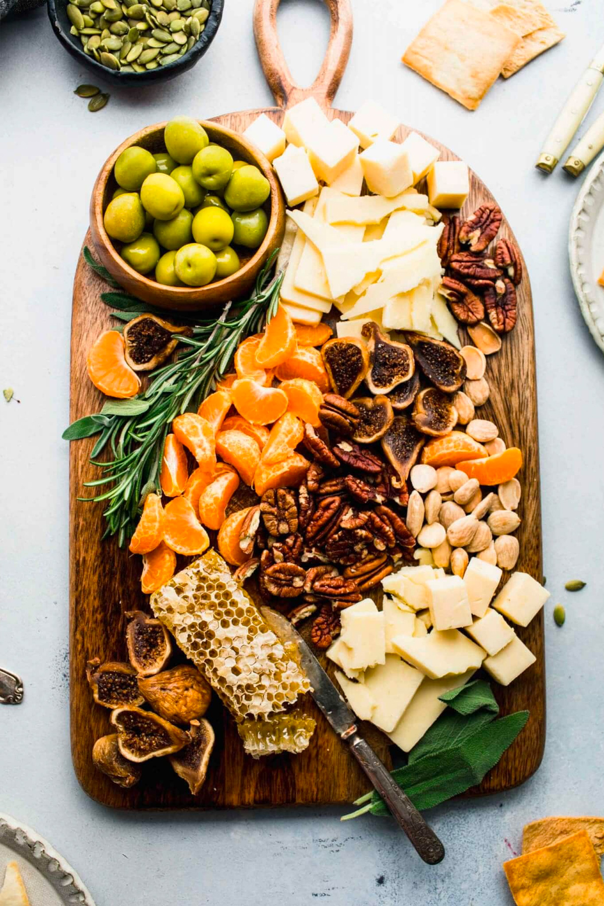 Nuts, cheese, clementine's, honey comb,  and figs are included on Platings and Pairings winter cheese board.