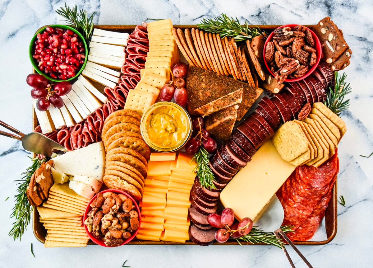 Meats, cheese, crackers, nuts, grapes, and other season fruit complete Project Meal Plan's winter cheese board.