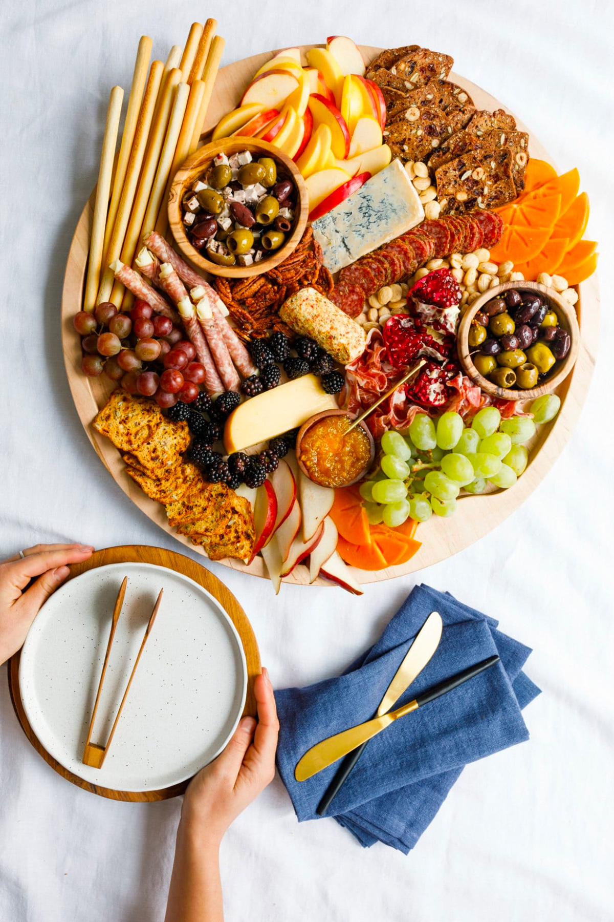 Crackers, cheese, meat, olives, and nuts are included on Reluctant Entertainer's winter charcuterie board.