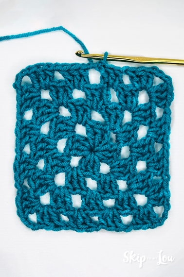 Final result - granny square crochet in blue yarn with a hook. Tutorial from skip to my lou