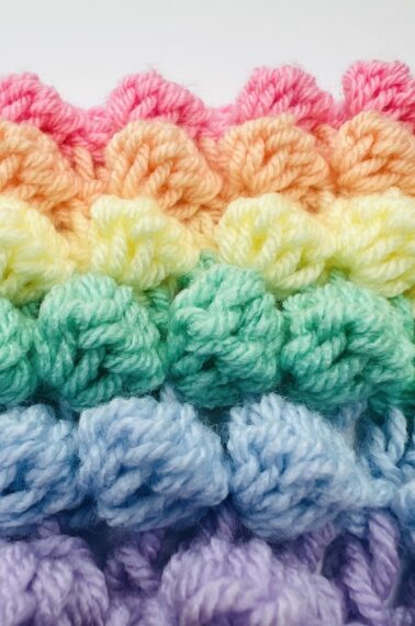 Finished multicolored bobble stitch pattern in pink, orange, yellow, green, blue, and purple.