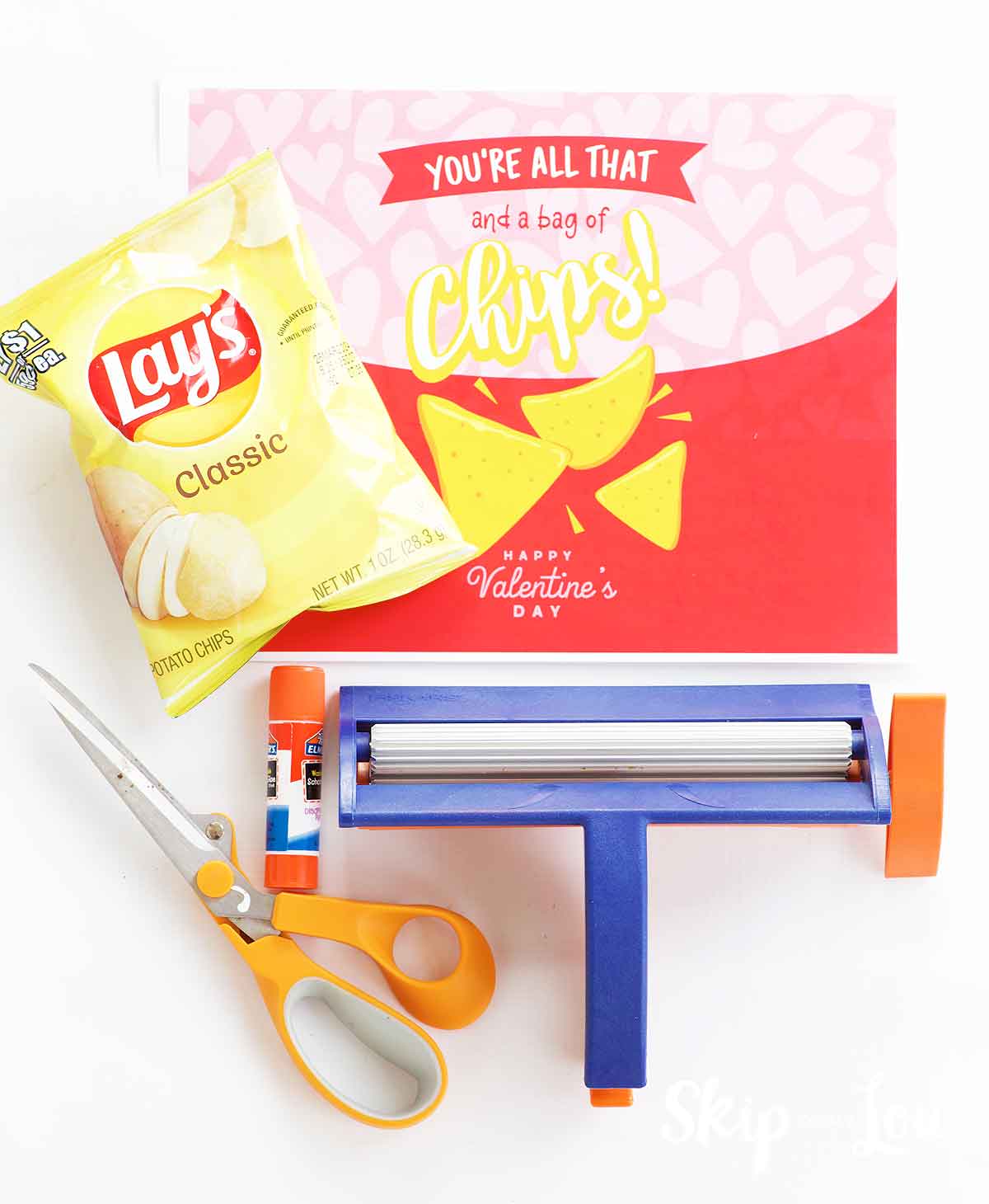 free chip bag template, paper crimper, scissors, glue stick, small bag of chips