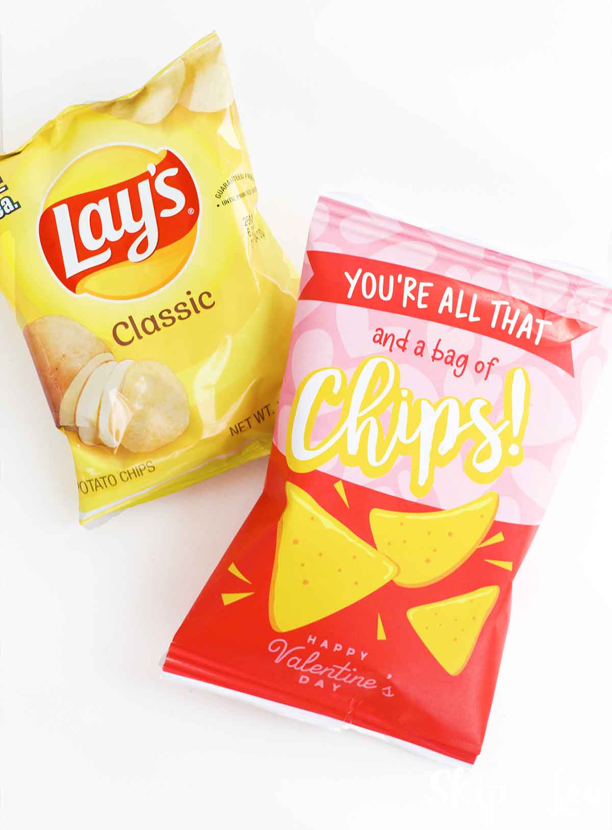 a bag of chips with a diy valentine bag of chips next to it