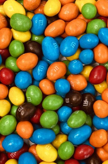 closeup of peanut M&Ms for the guess how many peanut M&Ms fit in a mason jar game