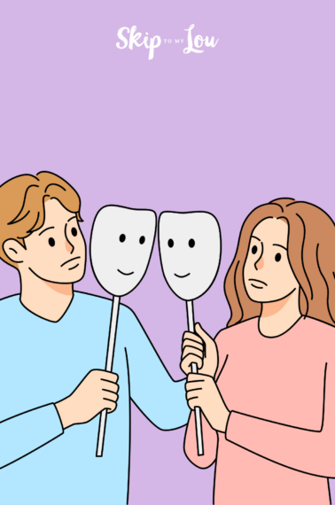 Image shows a man and a woman in front of each other, both holding a smiling teather mask.
