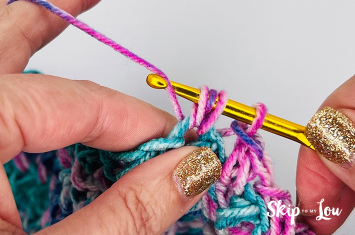 Crochet sample of the mini bean stitch in varying shades of pink and blue.