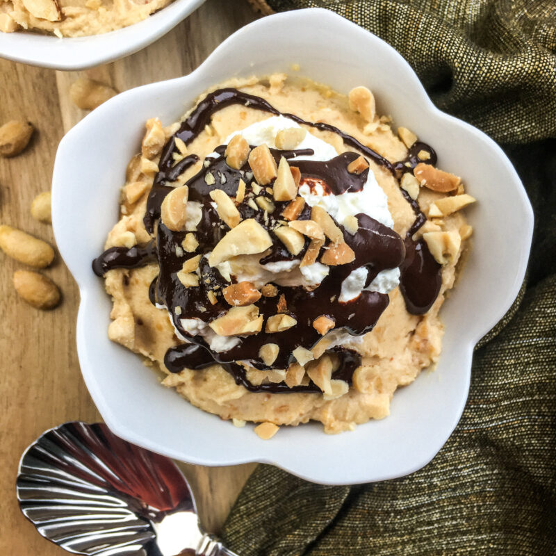 Final result of the chocolate peanut butter mousse parfait served on a white bowl.