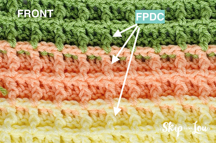 Waffle stitch crochet pattern in light yellow, orange, and green.