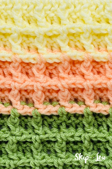 Waffle stitch crochet pattern in light yellow, orange, and green.