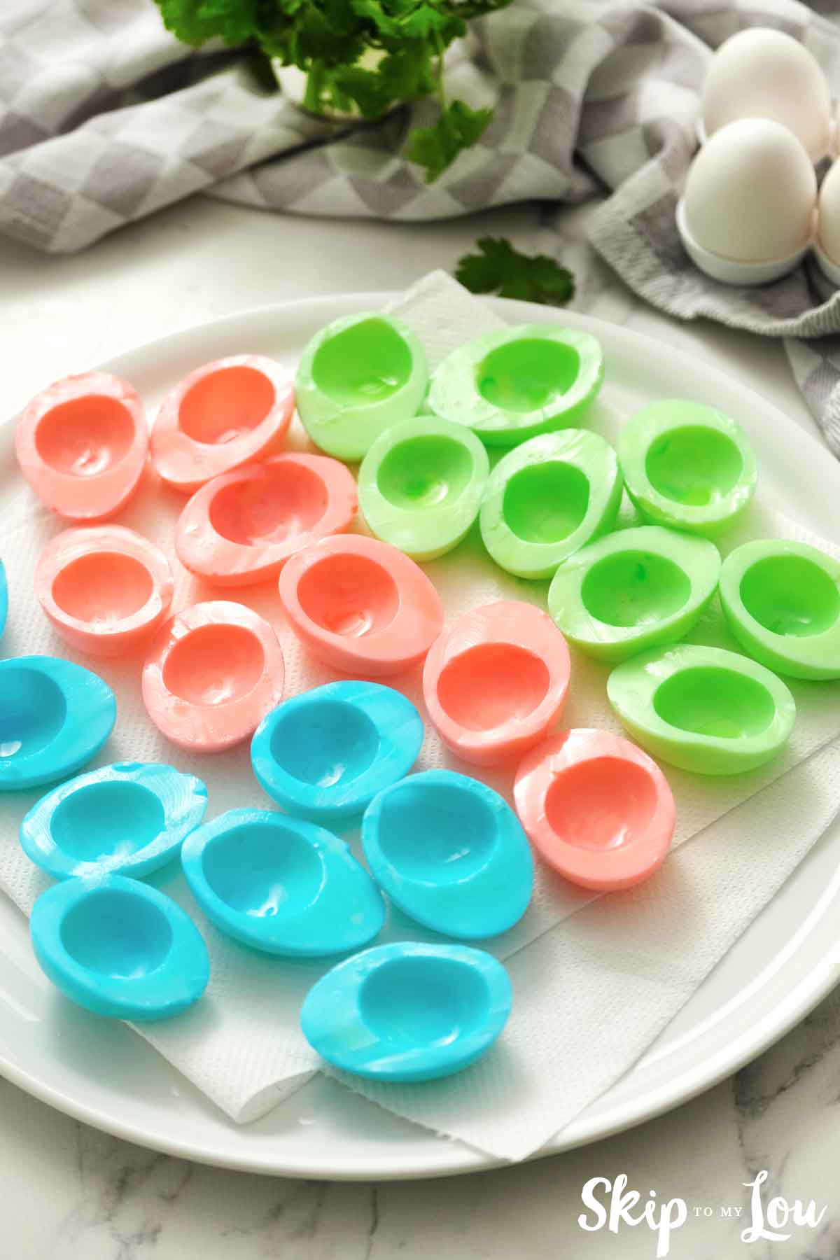 the colored hard boiled eggs on platter before being filled