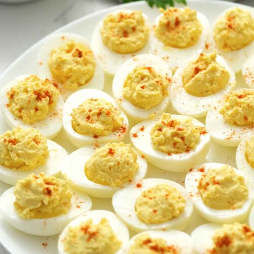 deviled eggs on white platter