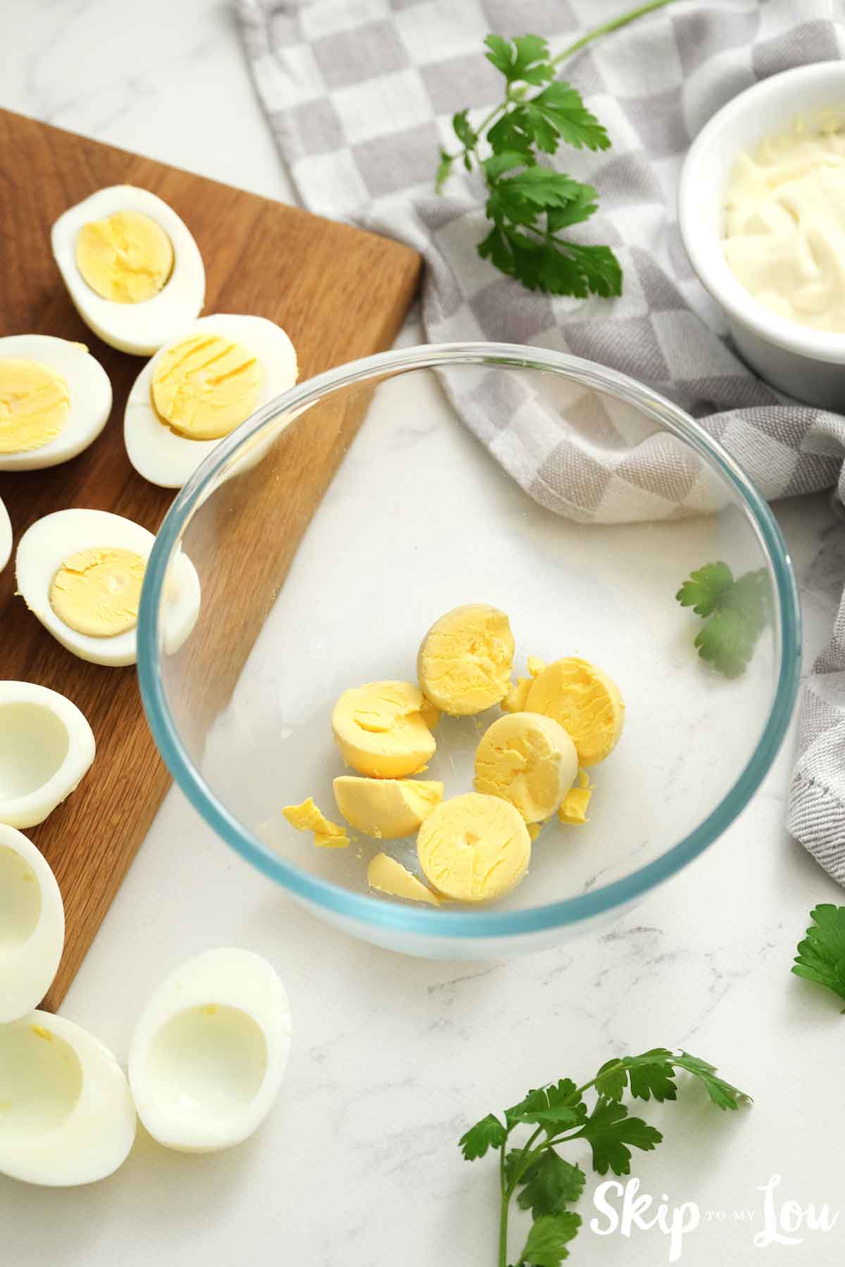 remove hard boiled egg yolks into a bowl