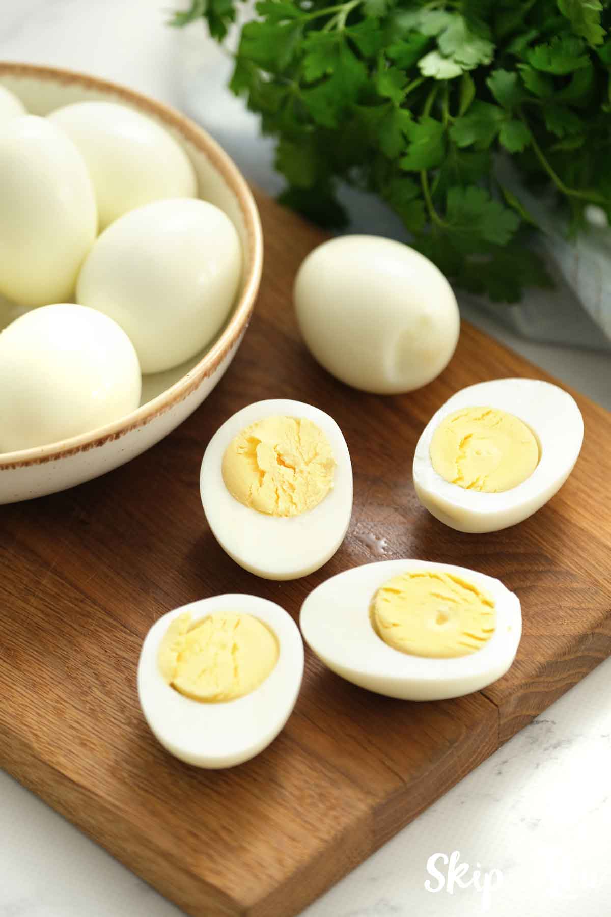 sliced hard boiled eggs on cutting board