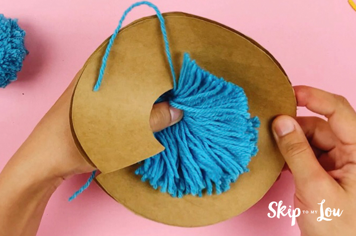 The cardboard is removed from the wool