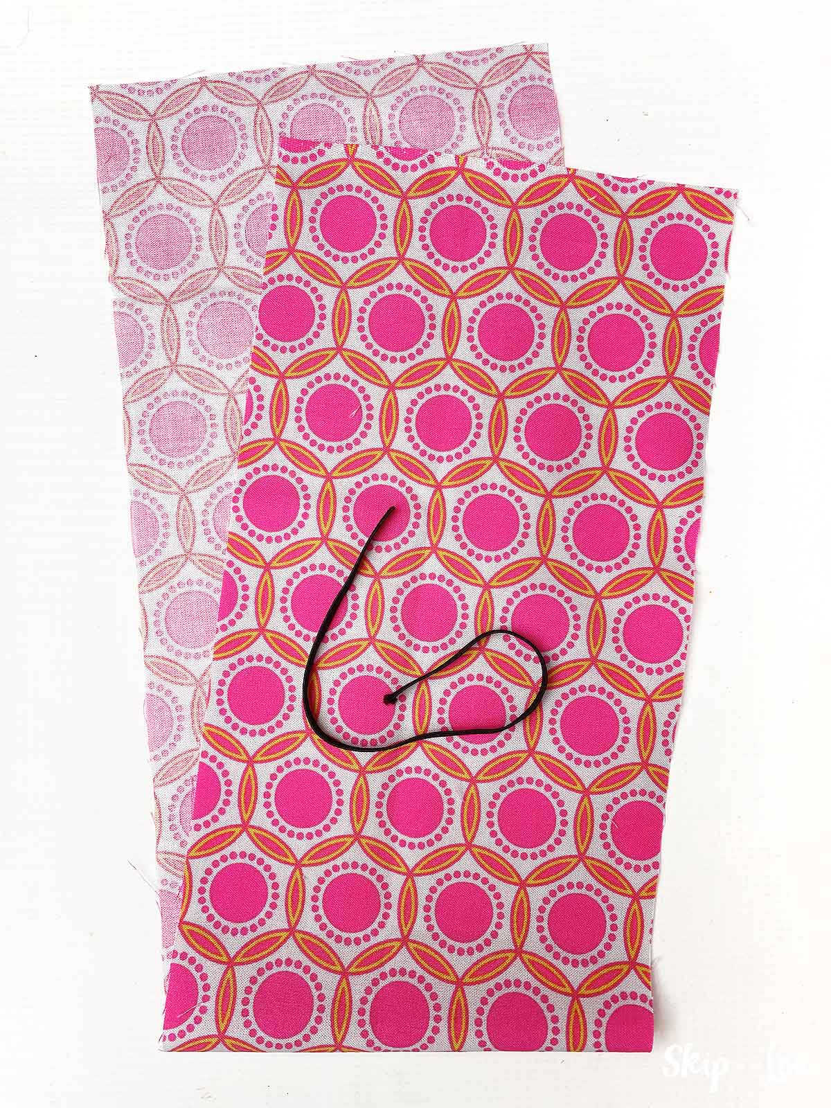 DIY scrunchie supplies rectangle of fabric and piece of black elastic