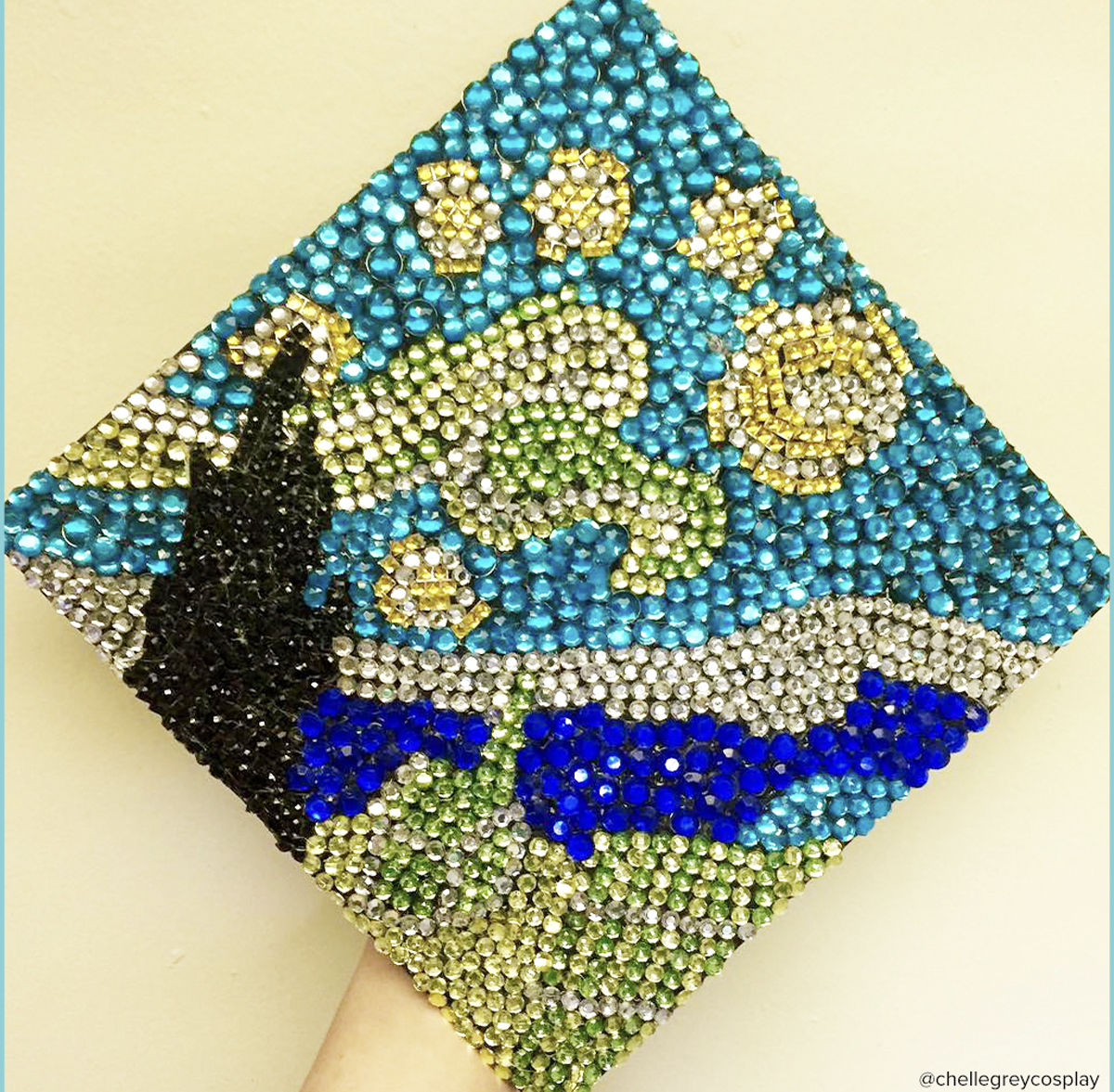 Graduation cap with bedazzled decoration, inspired by the starry night by Van Gogh.