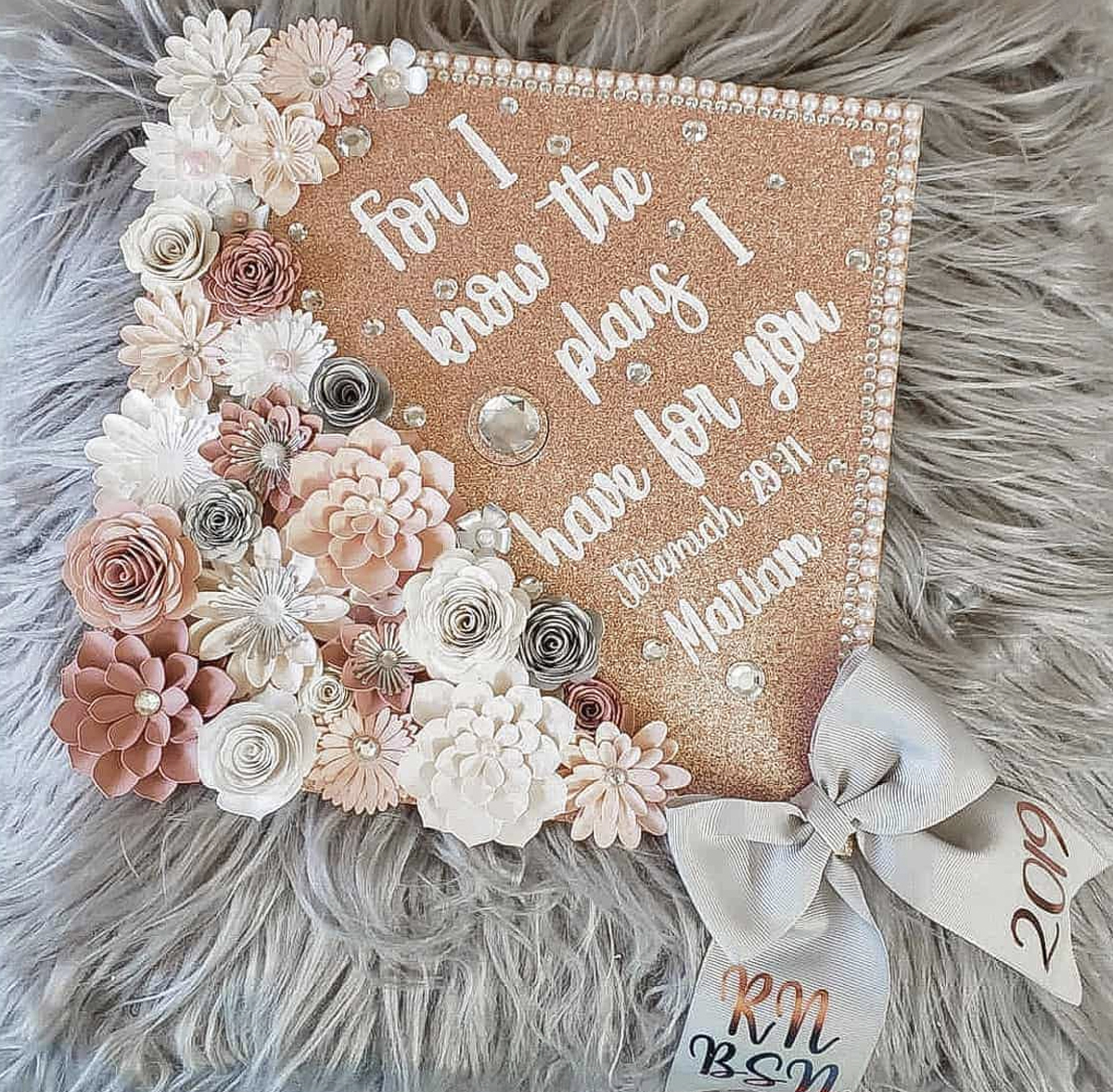 Light pink graduation cap with quote "For I know the plans I have for you"