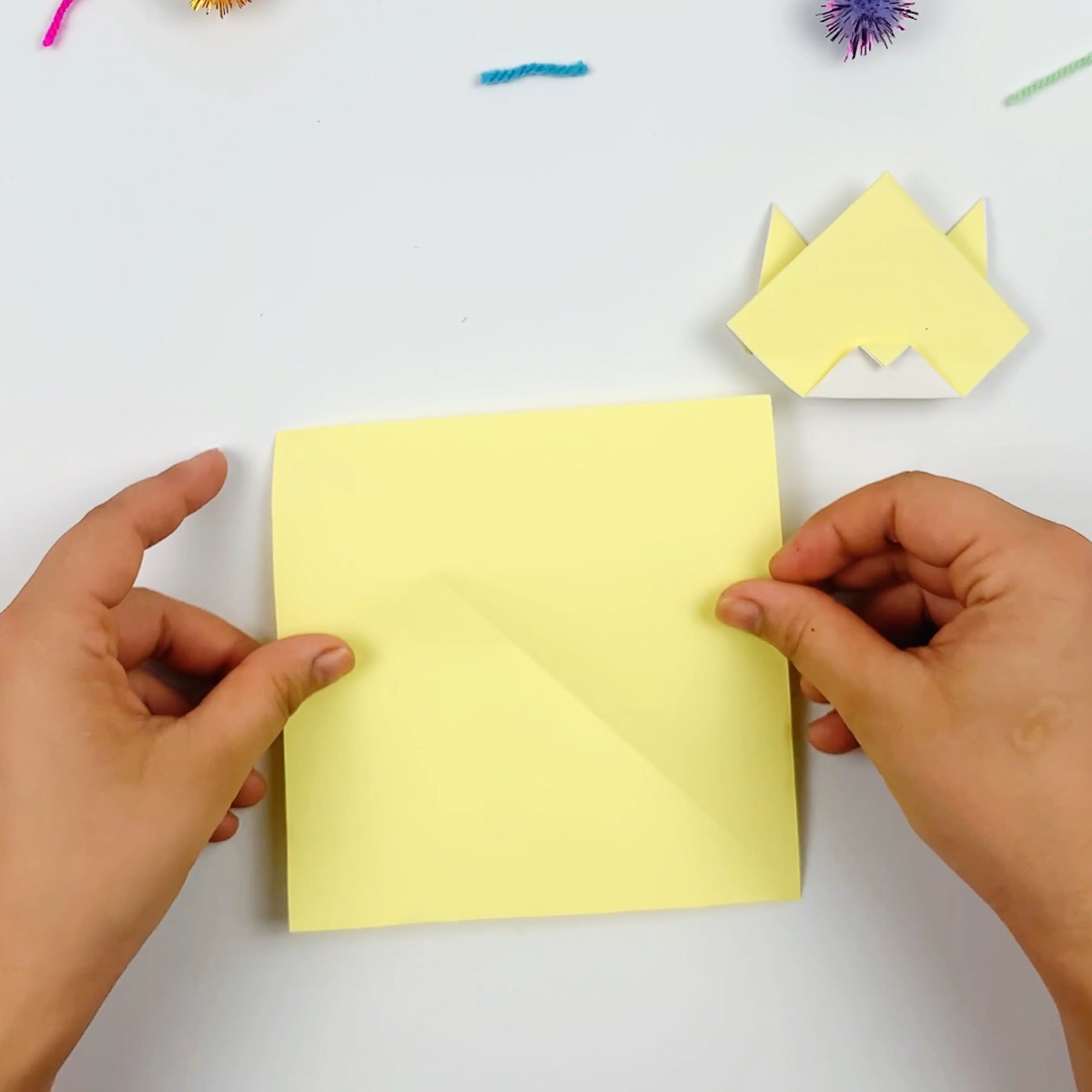 A bigger square piece of paper is needed for the origami cat's body.