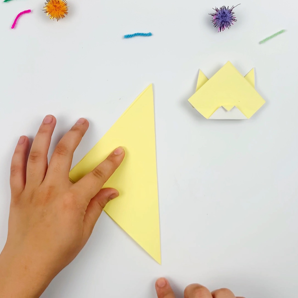 The paper is folded at a 45-degree diagonal.