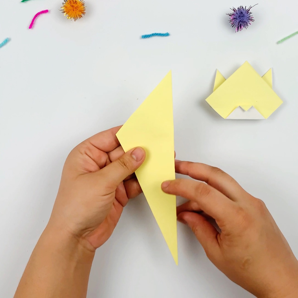 The body of the origami cat is taking shape.