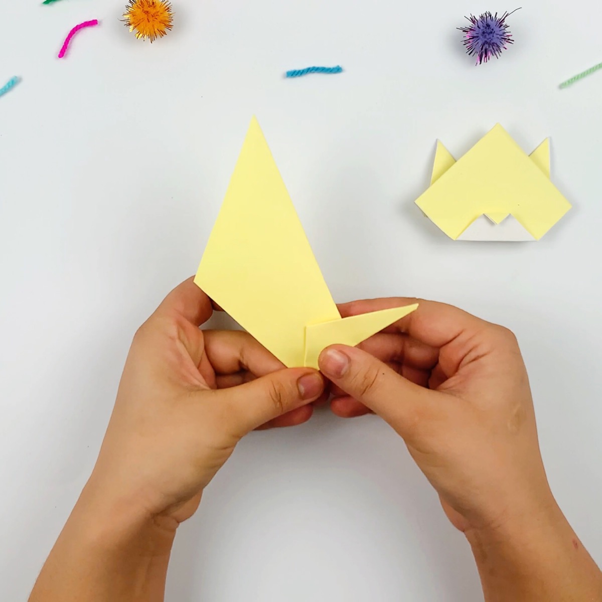 Again, the paper must be flattened into place to form a crease.