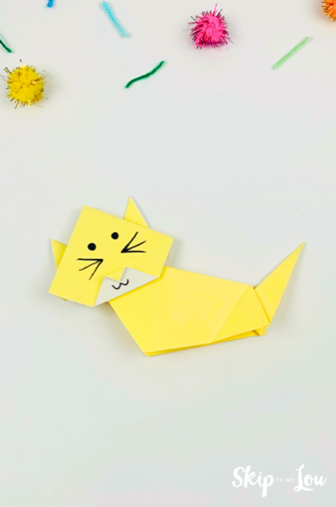 Yellow origami cat on grey background from Skip to My Lou.