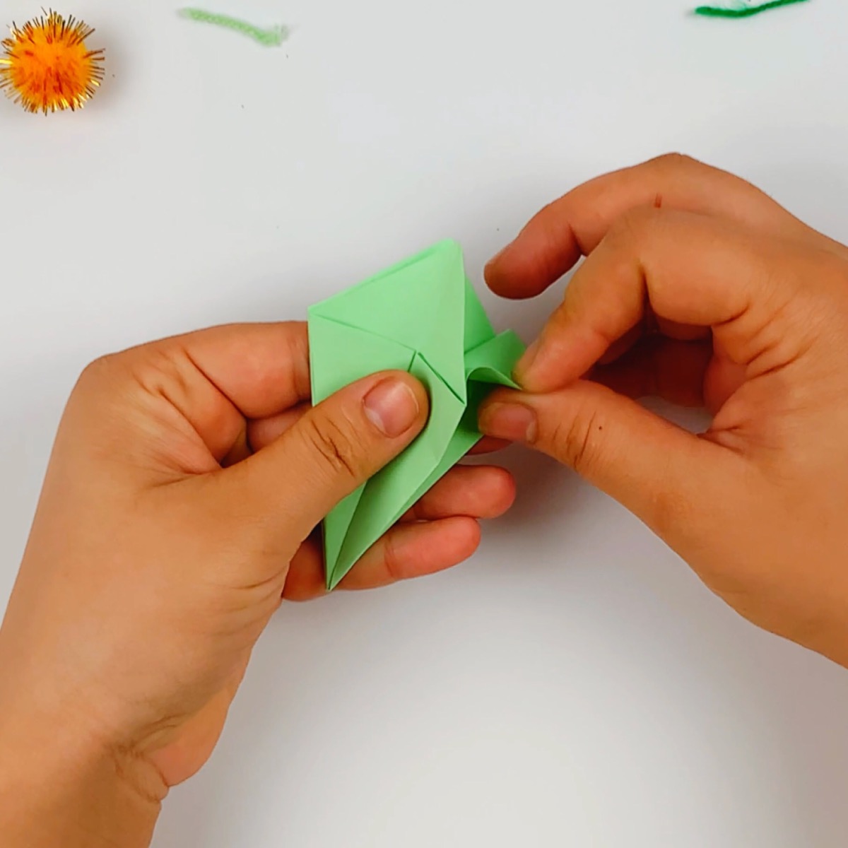 The paper is opened up and the fins are folded on the right hand side.