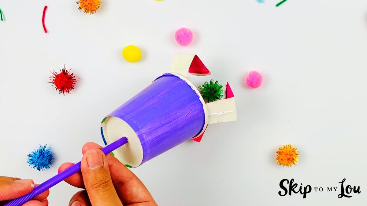 A paper cup mechanical claw in action.
