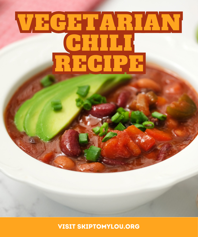 A beautiful bowl of vegetarian chili topped with cilantro and avocado garnish.