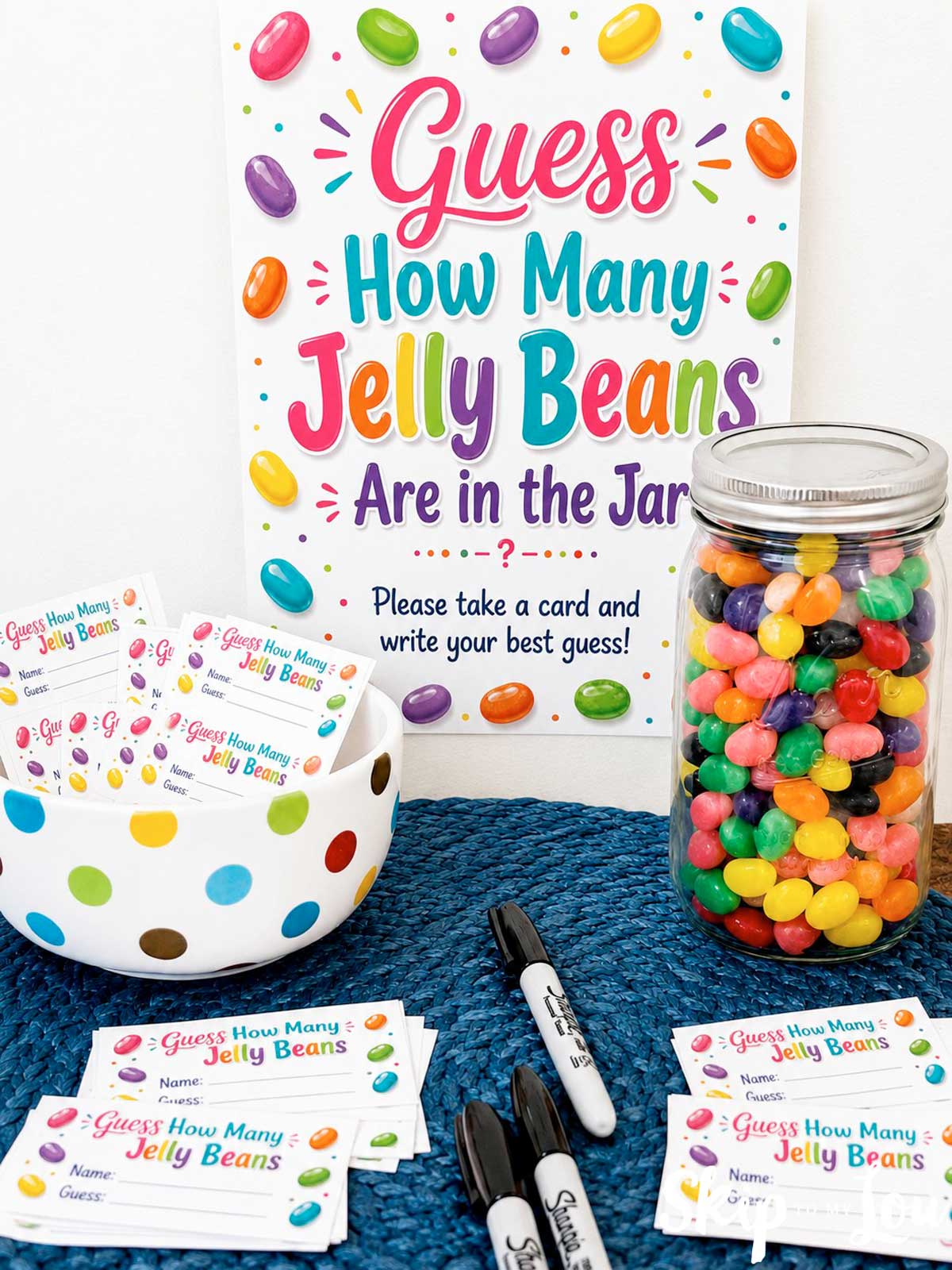 elly bean guessing game with printable sign, guess cards, markers, and a mason jar full of colorful jelly beans
