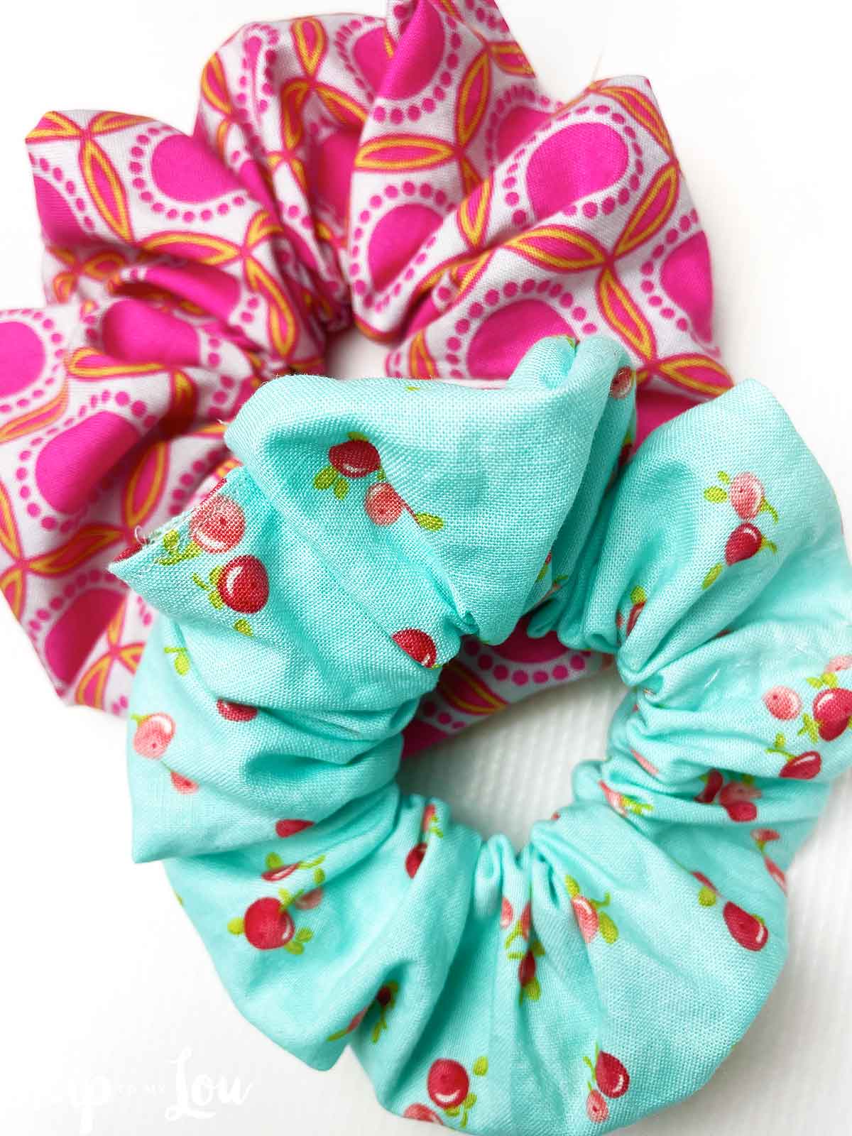 Two handmade scrunchies on white background from skip to my lou.