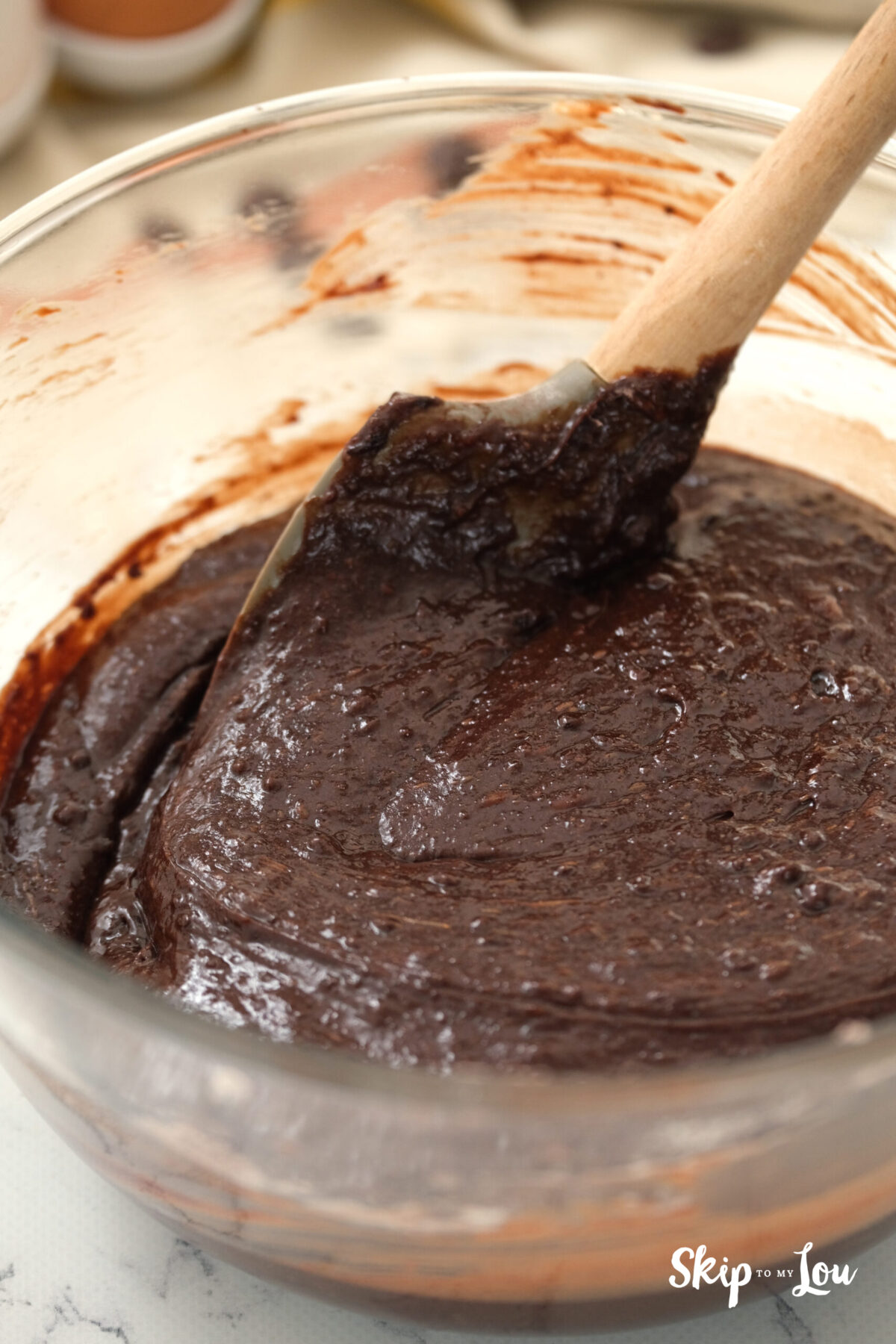The ingredients being mixed thoroughly in the bowl. 