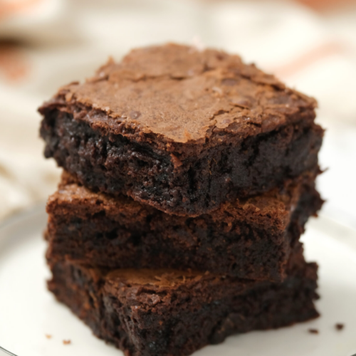 Chocolate brownie on a white plate made from Skip to My Lou's easy brownie recipe.