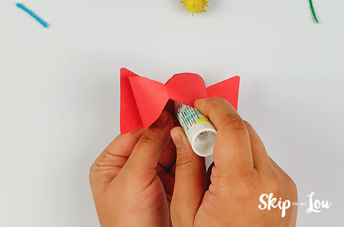 The bow tie shape is secured with glue. 