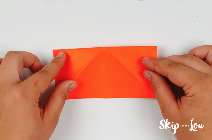 The paper is unfolded and flipped over.
