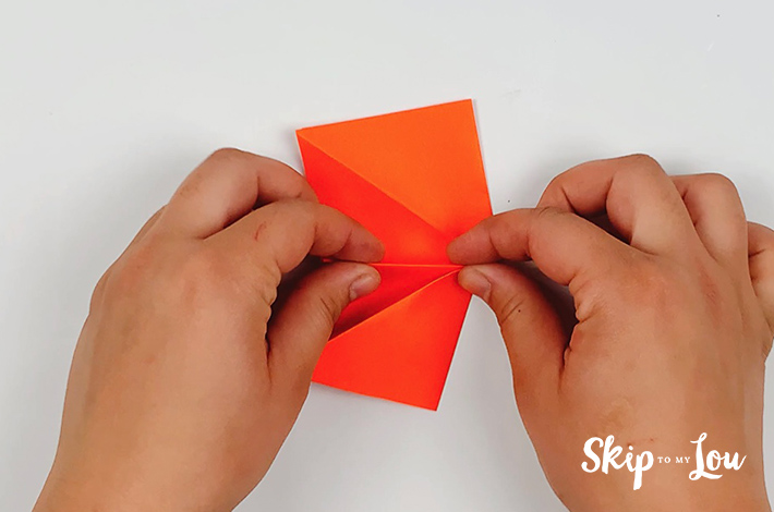 The process of folding smaller traiangles is repeated as you move up the origami leaf.