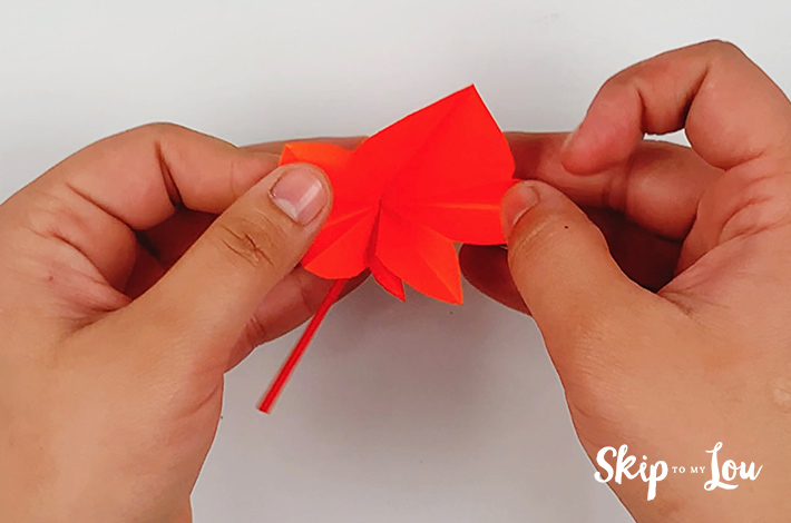 Once cut, the paper is opened up.