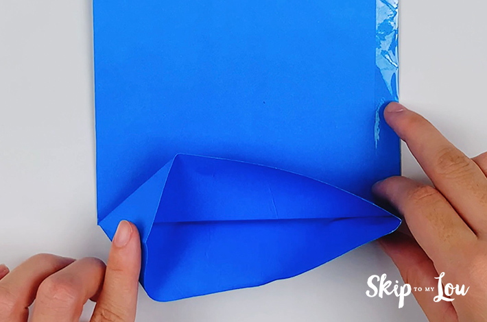 The bottom section is unfolded and a pocket opened.