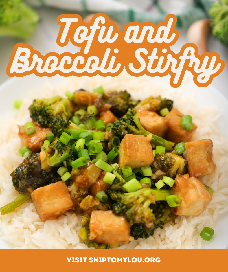 a white plate with rice and broccoli and tofu stir fry