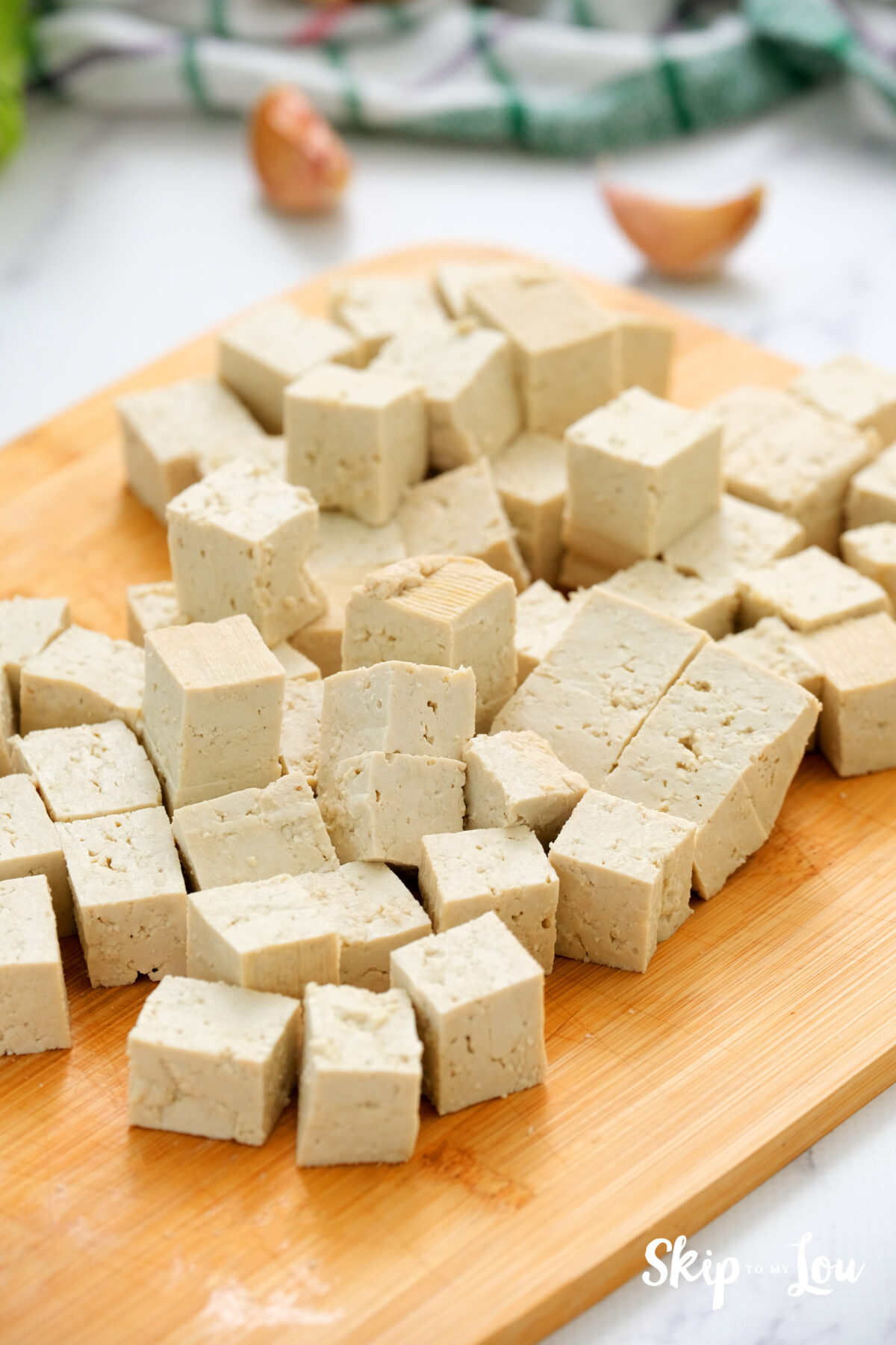 Cubes of tofu on a cutting board