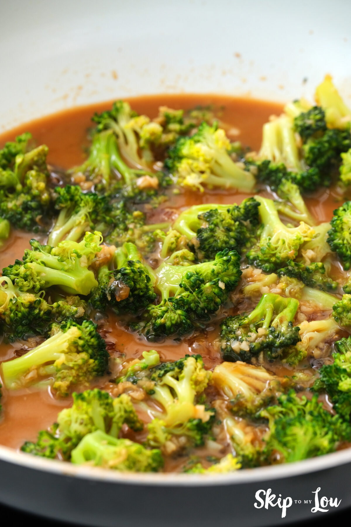 Broccoli cooking in soy sauce, honey and watered down cornstarch.